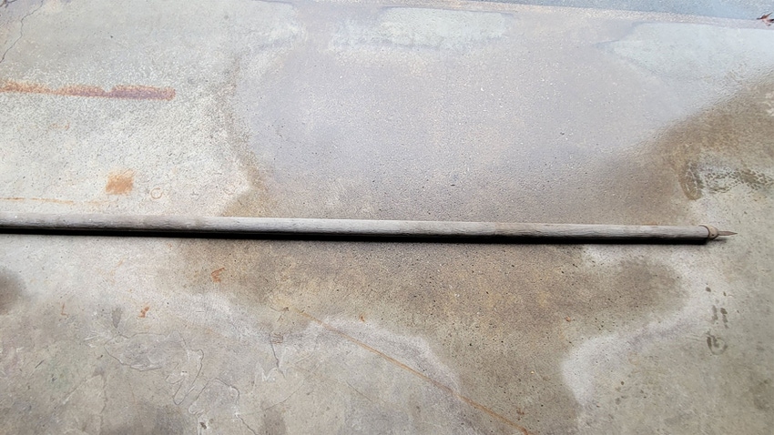 A long thin pole with an iron arrow tip