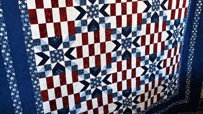 Quilt with red, white and blue fabric 