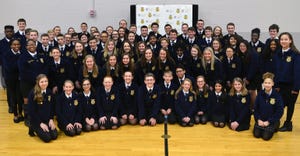 Members of the Global Impact STEM Academy FFA chapter pose with the National FFA officer team