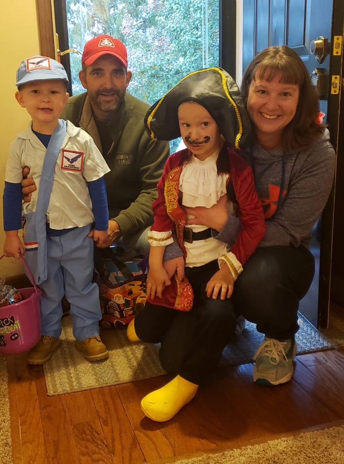 Reskovac family kids dressed for Halloween as a mailman and a pirate