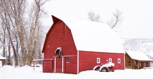 Red barn in snow on the farm 