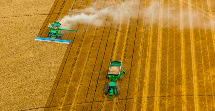 Aerial view of combines working during the wheat harvest, Schields & Sons Farming, Goodland, Kansas USA.