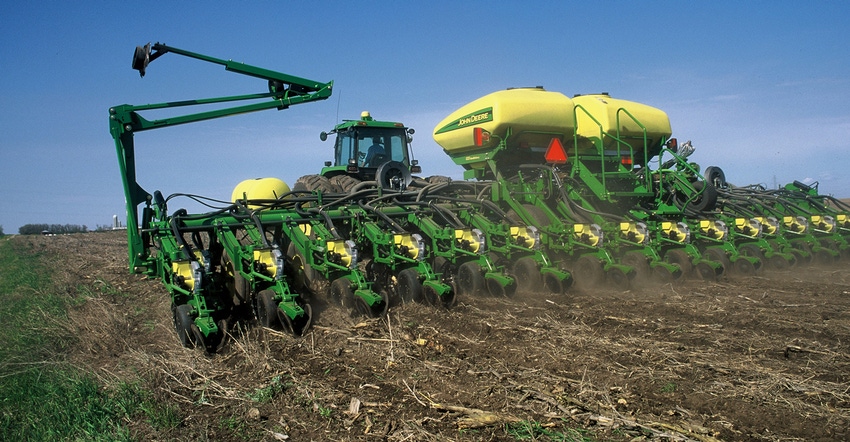 John Deere planter in field