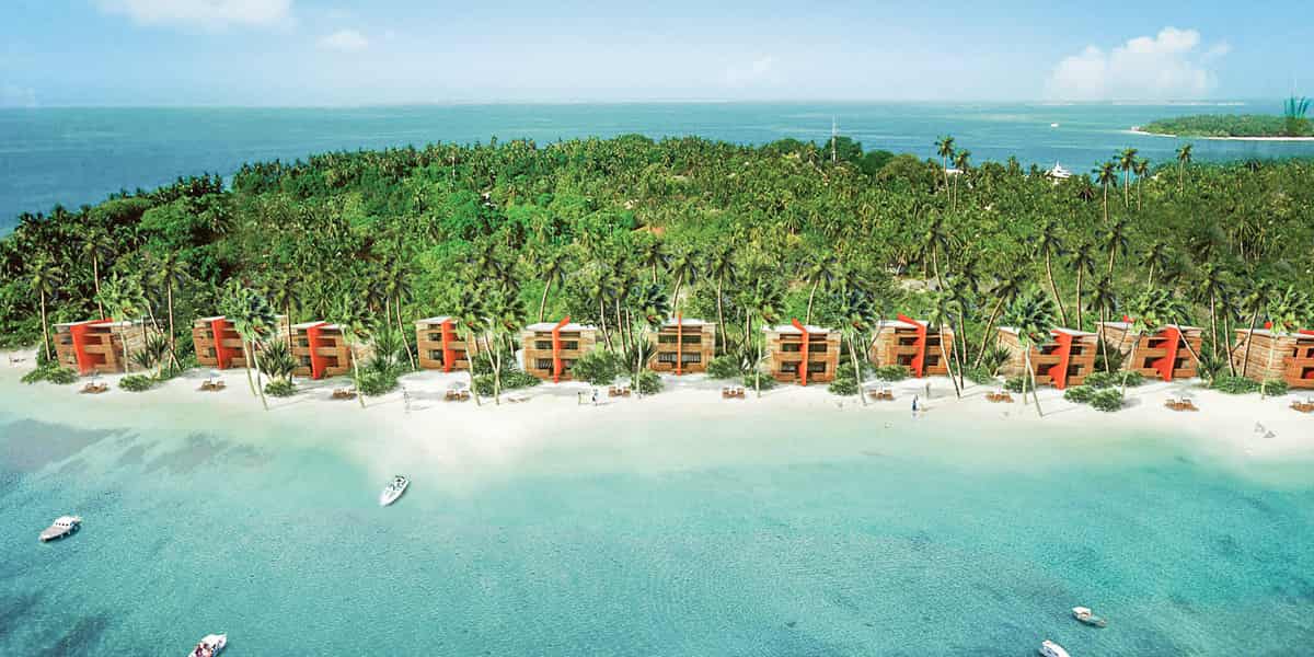 Hotelanlage des The Barefoot Eco mit direkter Strandlage, Palmen im Hintergrund