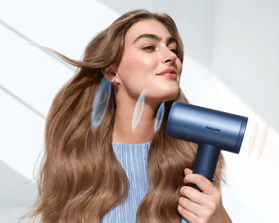 Hair dryer featuring intelligent sensors to actively monitor and adapt airflow temperature