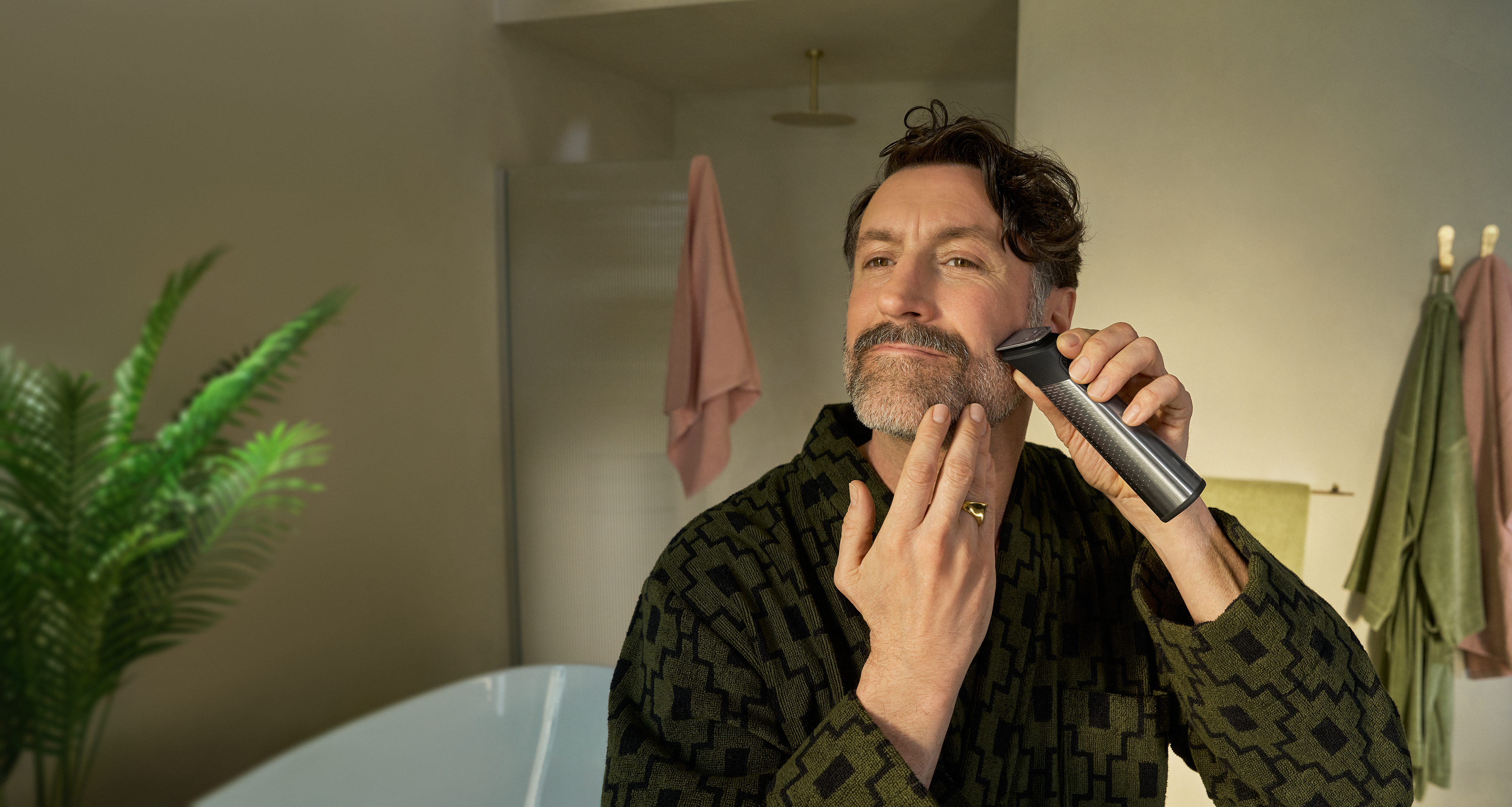 Man trimming beard using Philips All-in-One Trimmer 9000