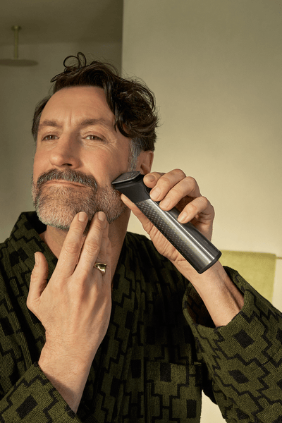 Man trimming beard using Philips All-in-One Trimmer 9000