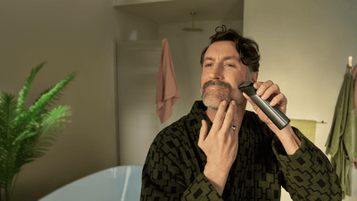 Men shaving his beard