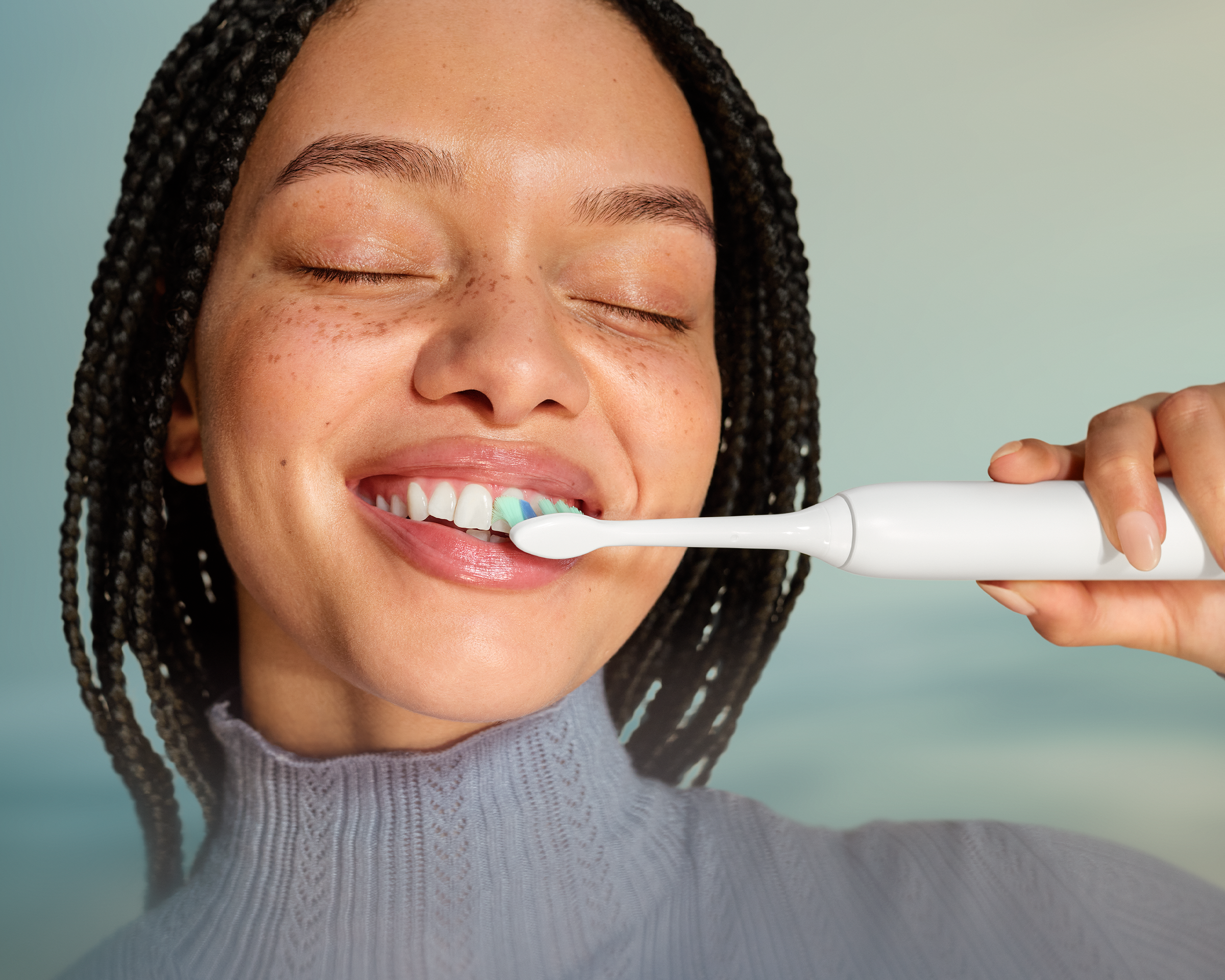 A patient brushing with the power toothbrush.