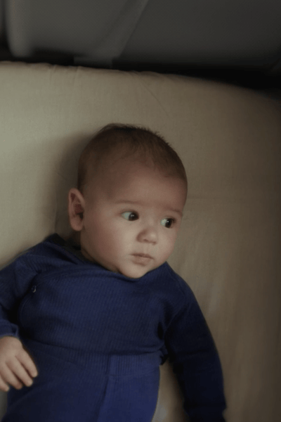 A baby in a crib