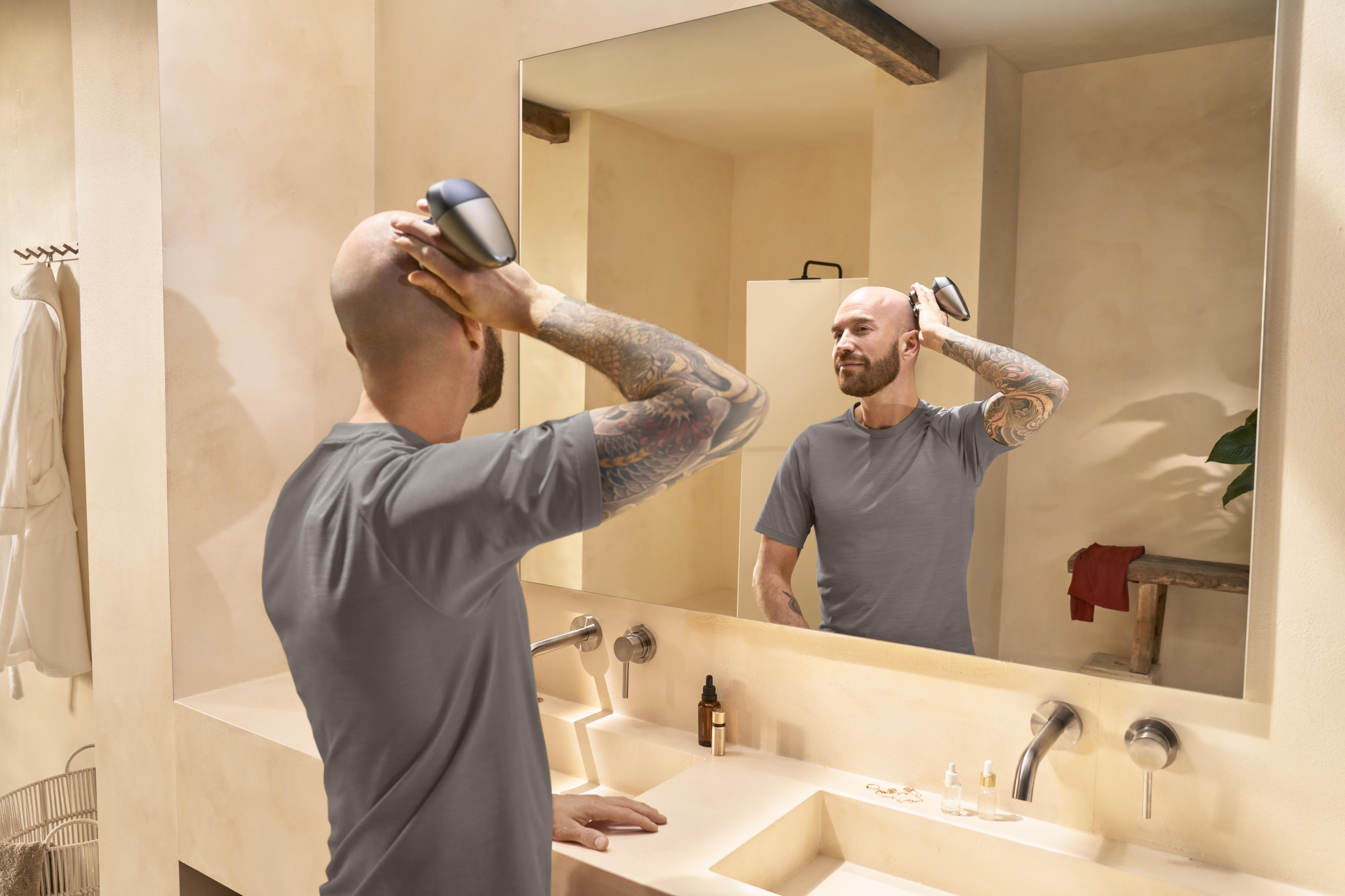 Philips Head Shaver for smooth, bald look in bathroom