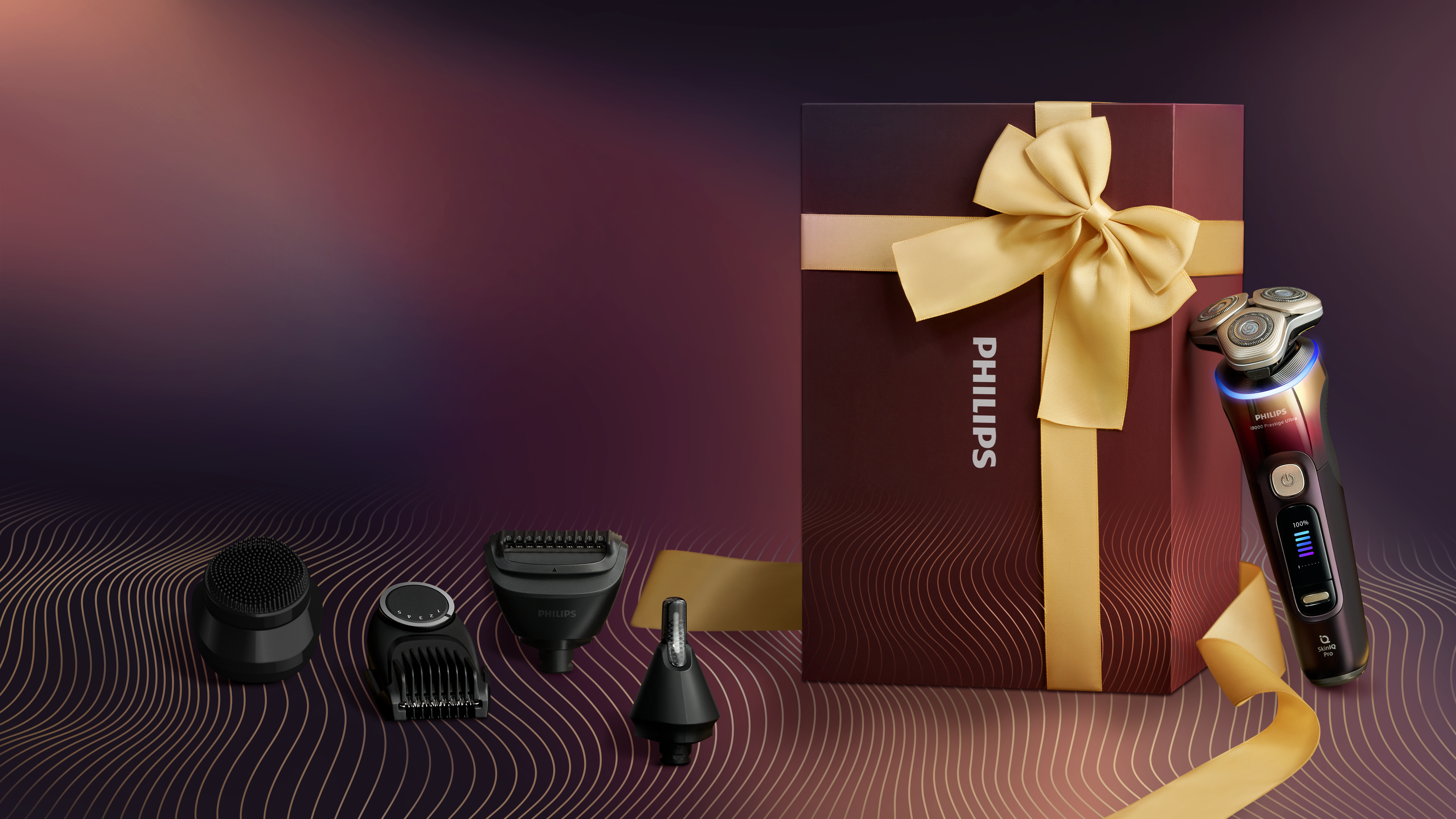 Dárková sada holicího strojku Philips i9000 s nástavci a krabicí, která představuje všestranné nástroje péče jako prémiový dárek