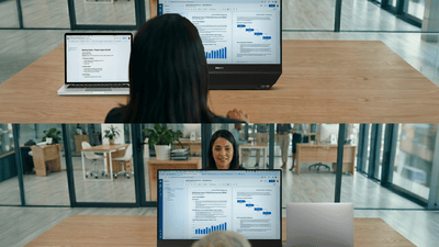 showcasing dual sided monitor in a workplace