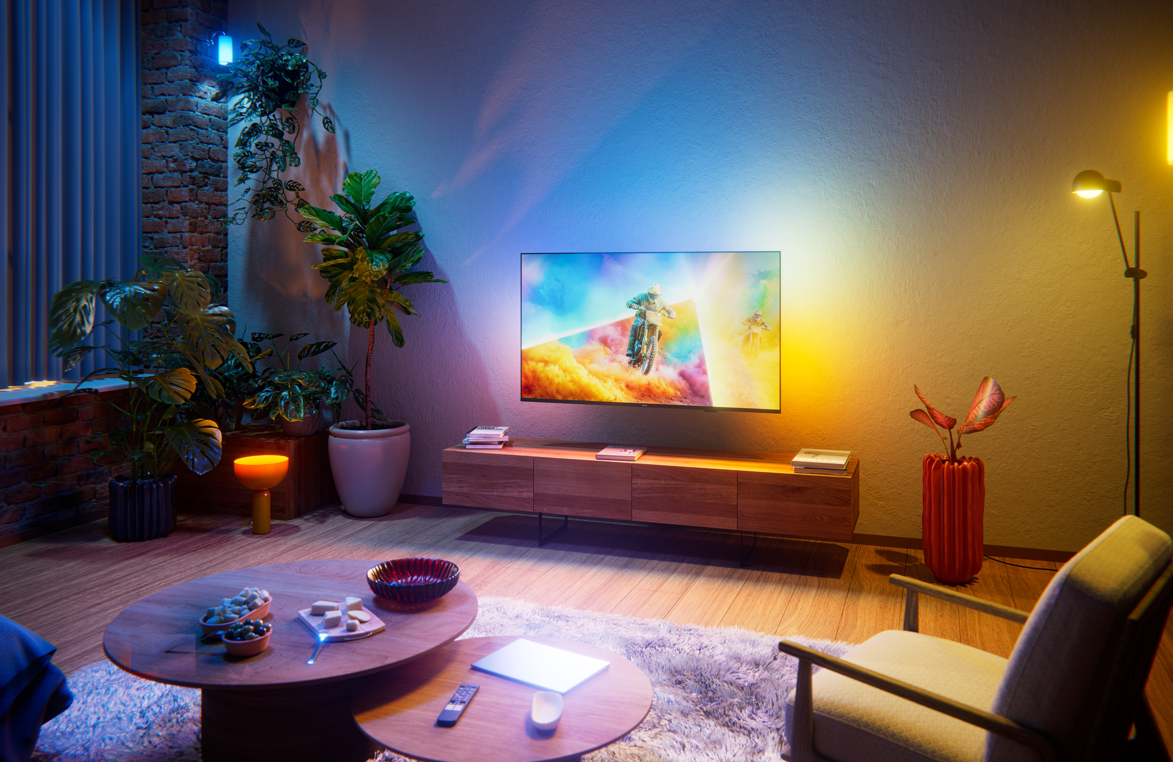 55 inch Philips Ambilight TV in a living room - side view