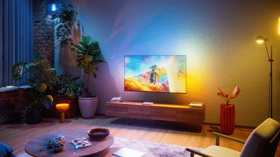 55 inch Philips Ambilight TV in a living room - side view