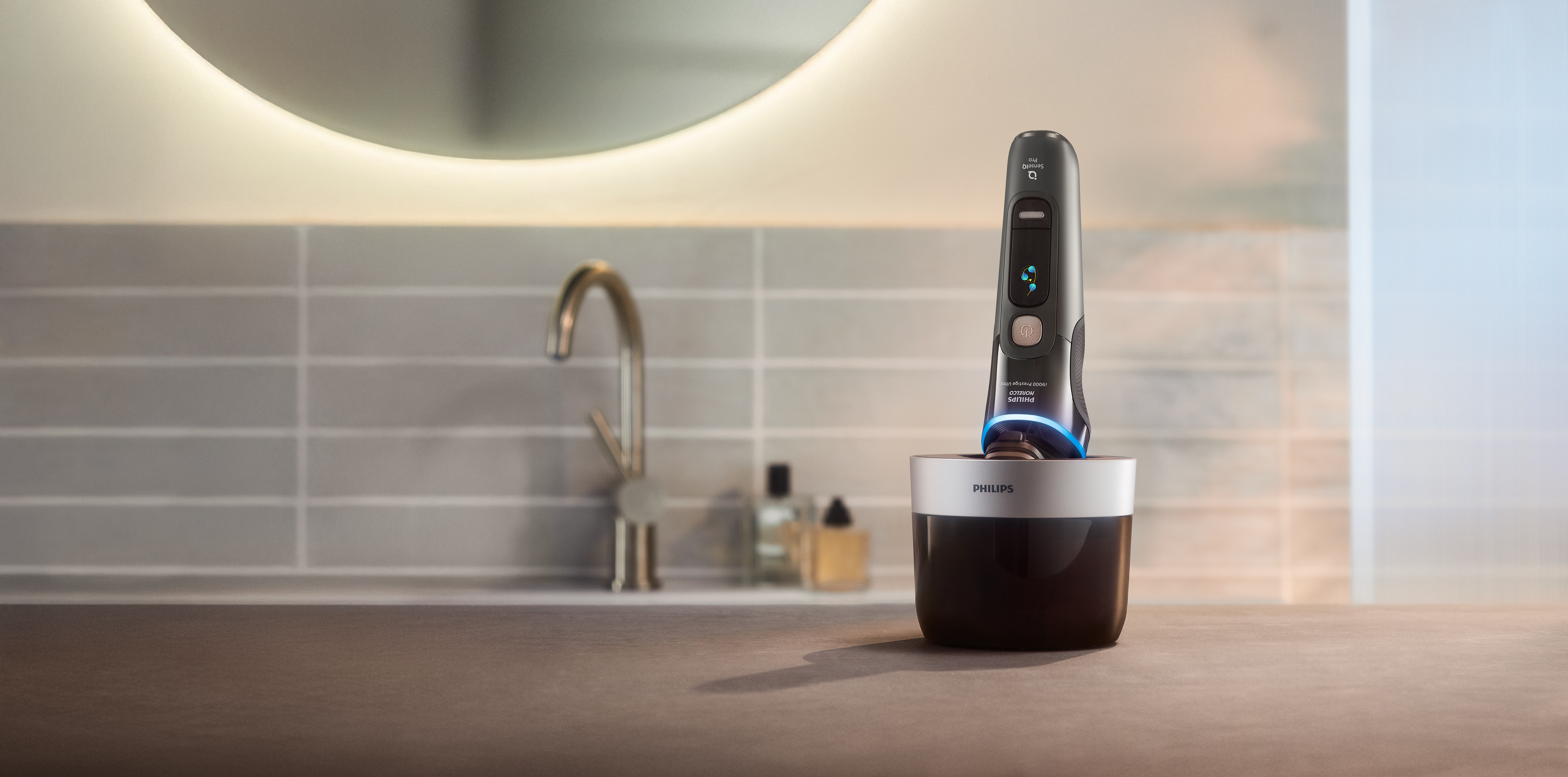 A hand holding an electric shaver