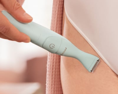 Woman shaving leg