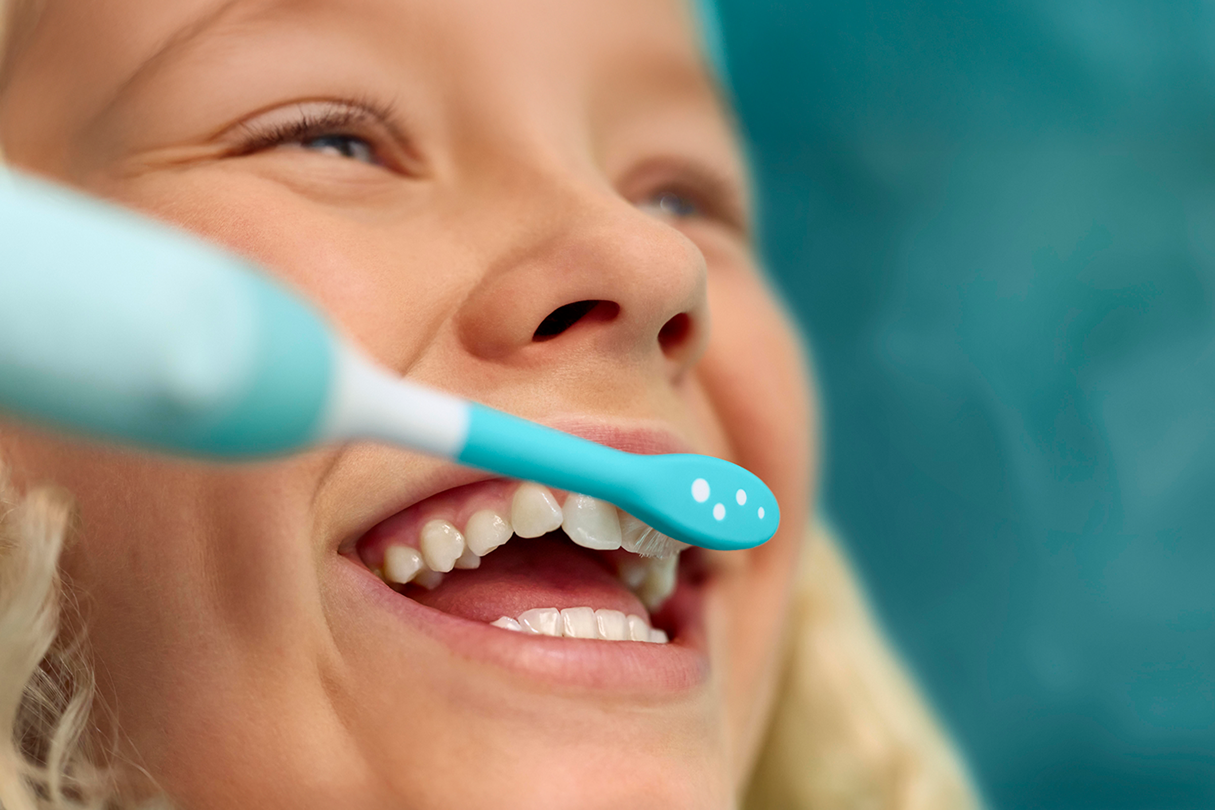 Image of child brushing teeth