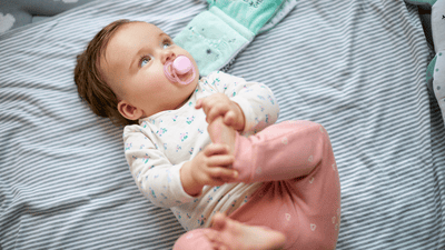 Playful baby with big curious eyes