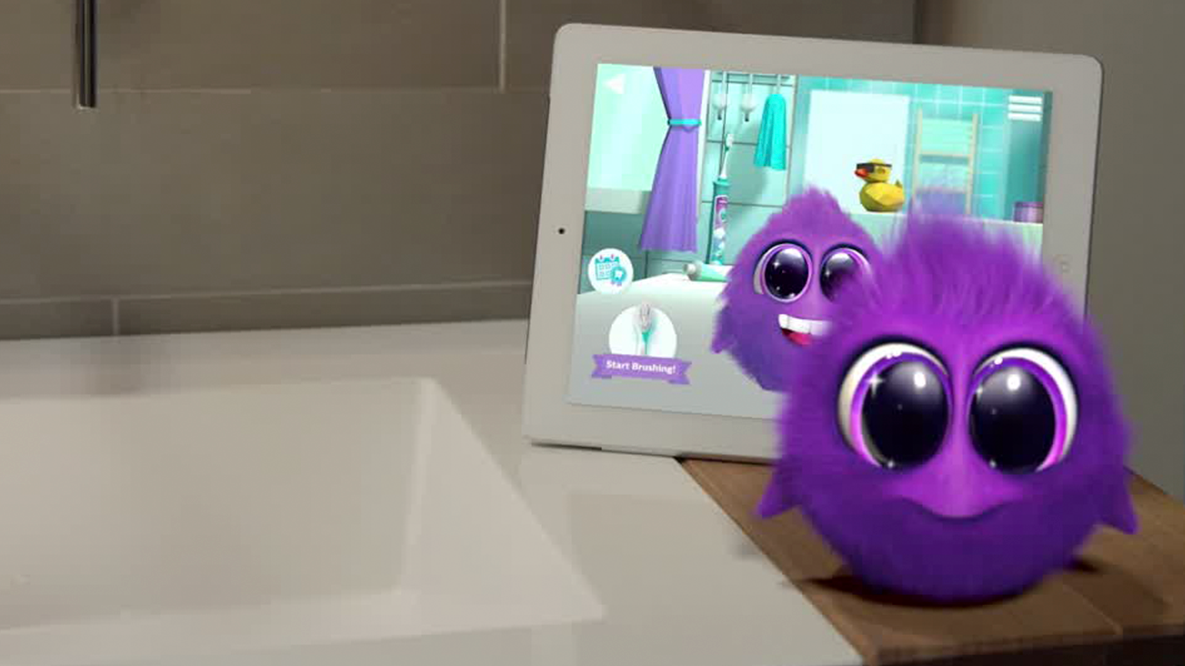 Sparkly voor de Sonicare For Kids-app naast een wastafel.