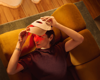 Person using Philips LED Face Mask in Age Care mode with red light therapy