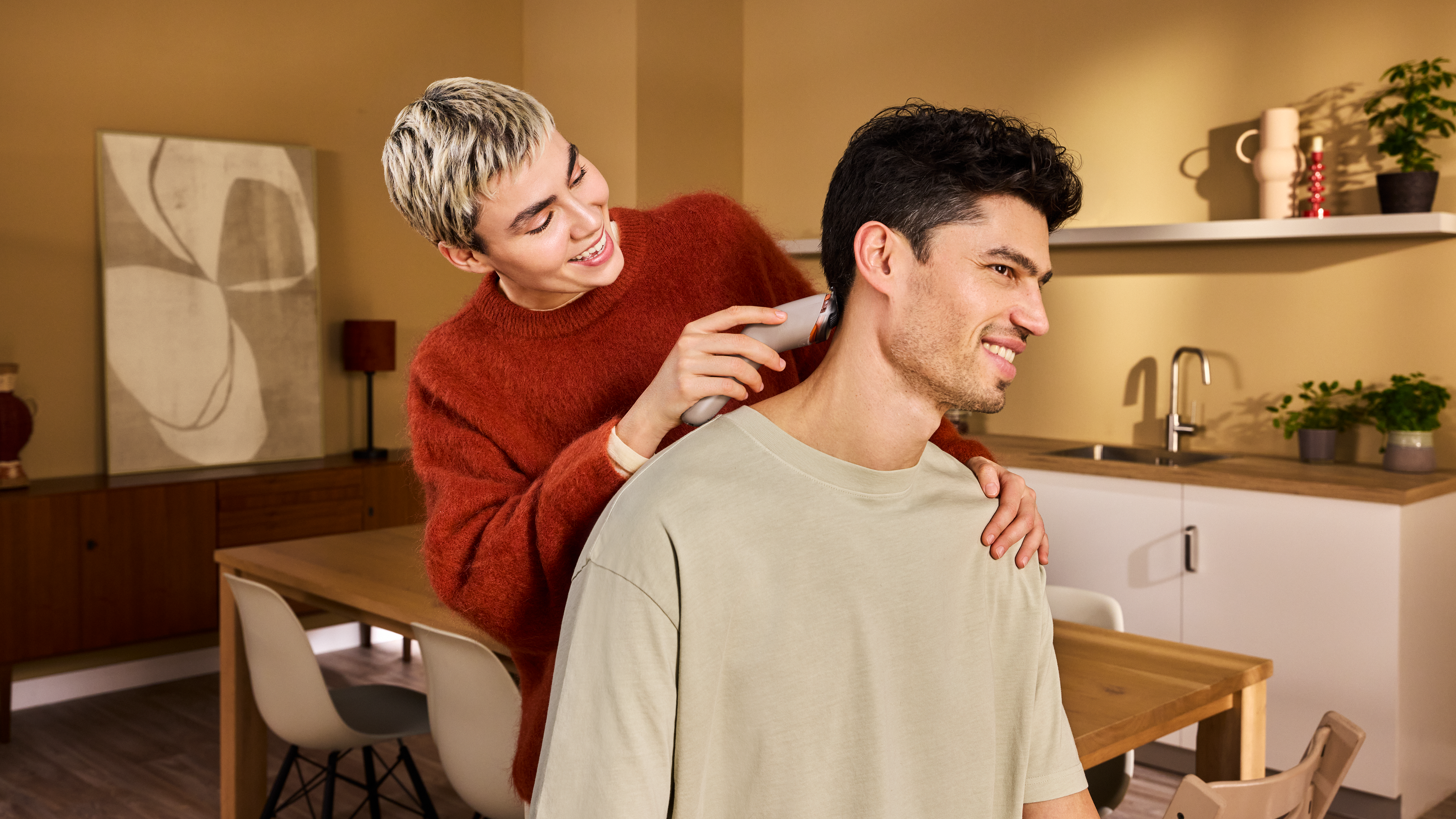 Man trimming his hair with the hair clipper