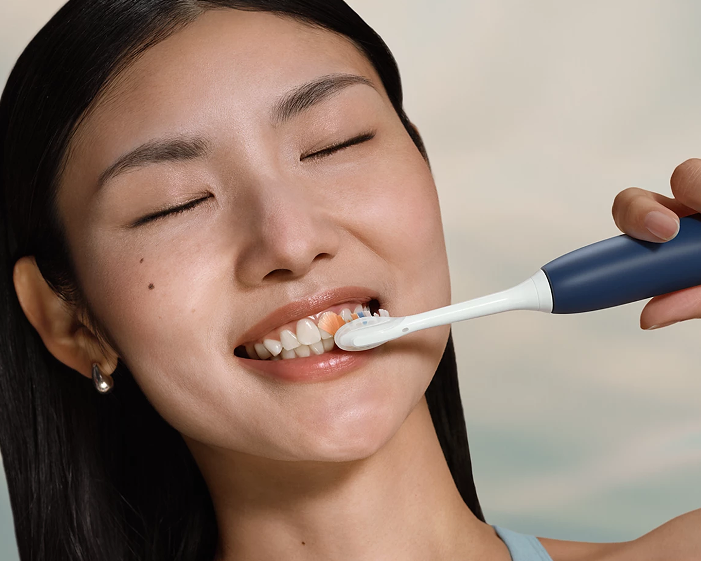 A patient brushing with Philips Sonicare 7400.