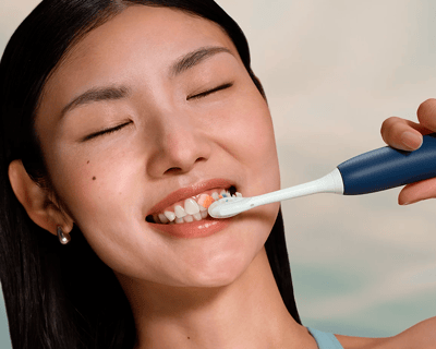 A patient brushing with Philips Sonicare 7400.