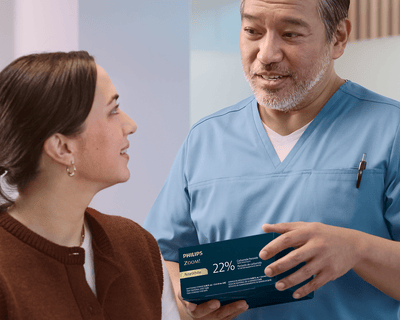 Patient with dentist looking at a tablet