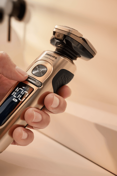 A hand holding a razor