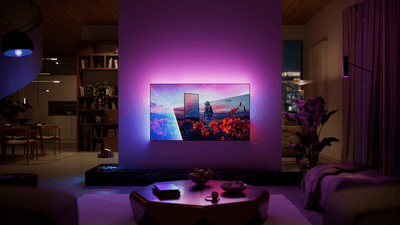 Philips Ambilight TV in a dark room - frontal view