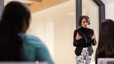 Image of woman presenting to audience