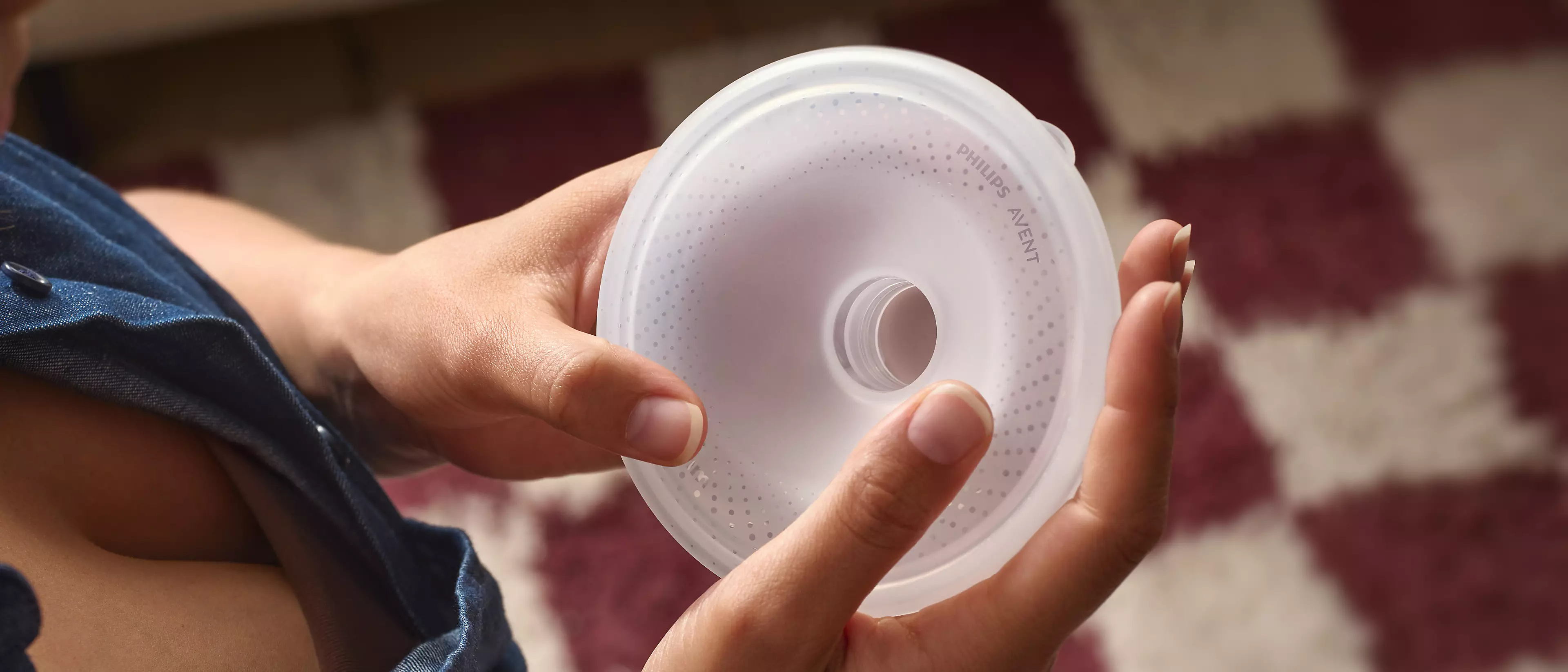 Mom holding silicon breast shield