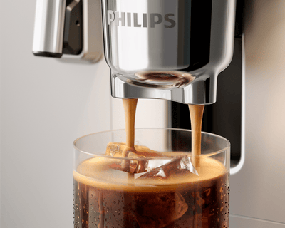 Brewing a double shot of cold brew into a cup