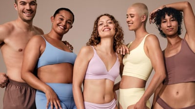 A product image of a Philips Lumea IPL device and attachments on a woodan table.