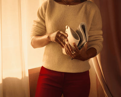 Person holding the Philips LED Face Mask showcasing its lightweight and flexible design