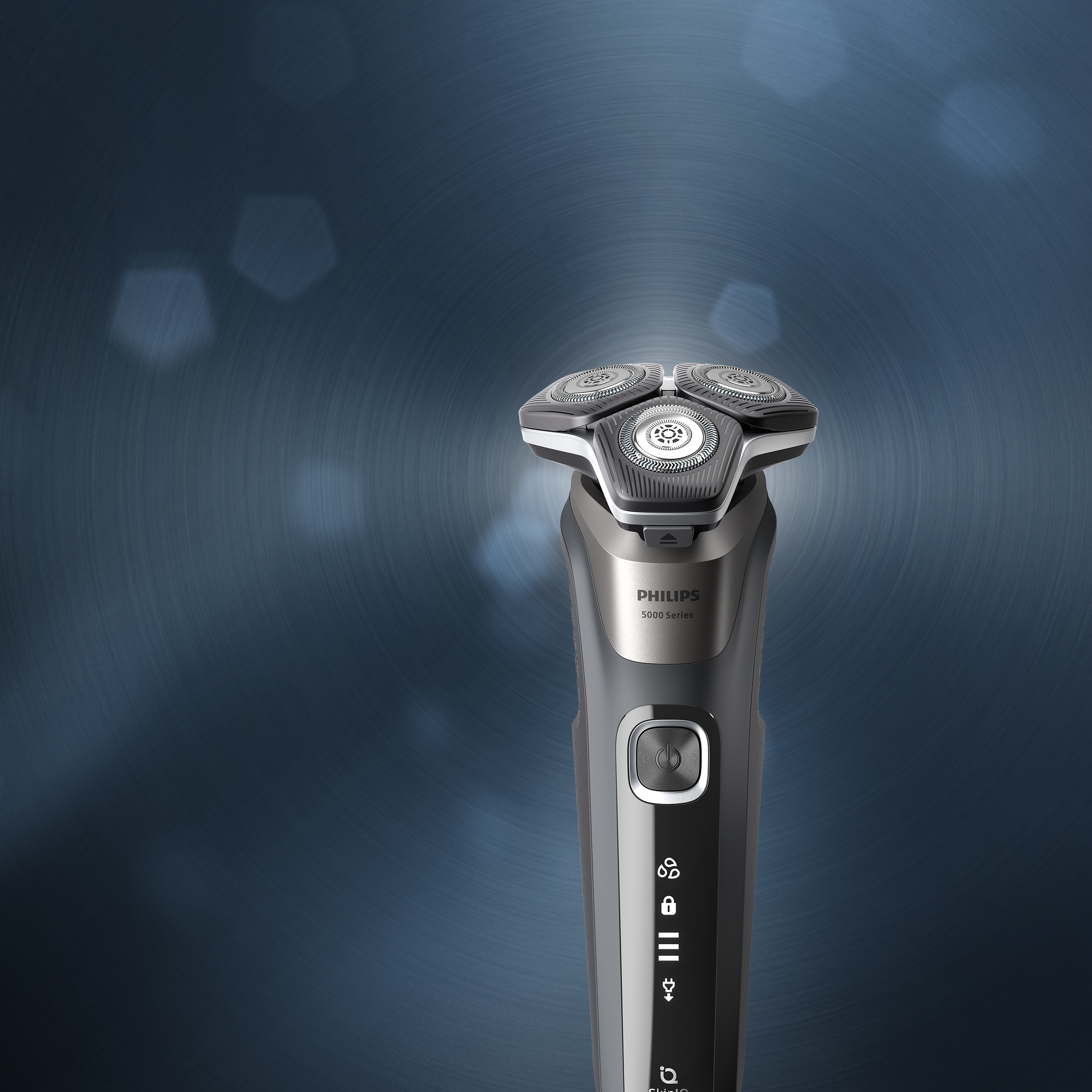 Philips electric shaver standing upright on a blue background, showcasing a sleek design and rotary shaving head for a close, comfortable shave.