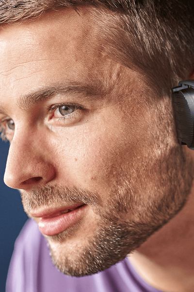 Man trimming his hair with the hair clipper