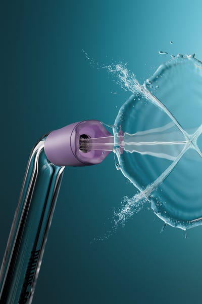A Quad Stream nozzle spraying water in an X-shape.