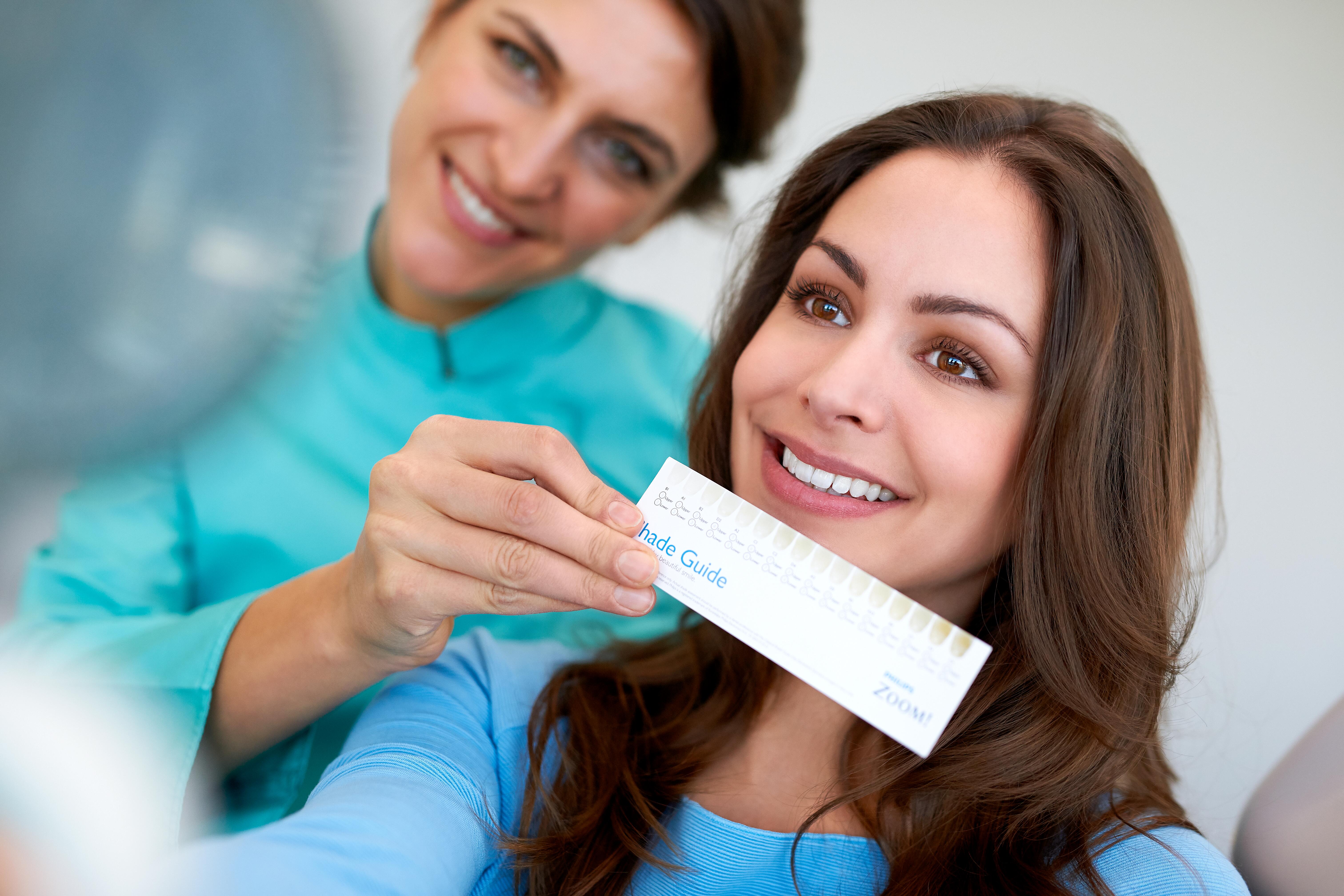 A two-phase, three-month clinical evaluation comparing two chairside tooth bleaching treatments, with tooth shade maintenance by powered or manual toothbrushing