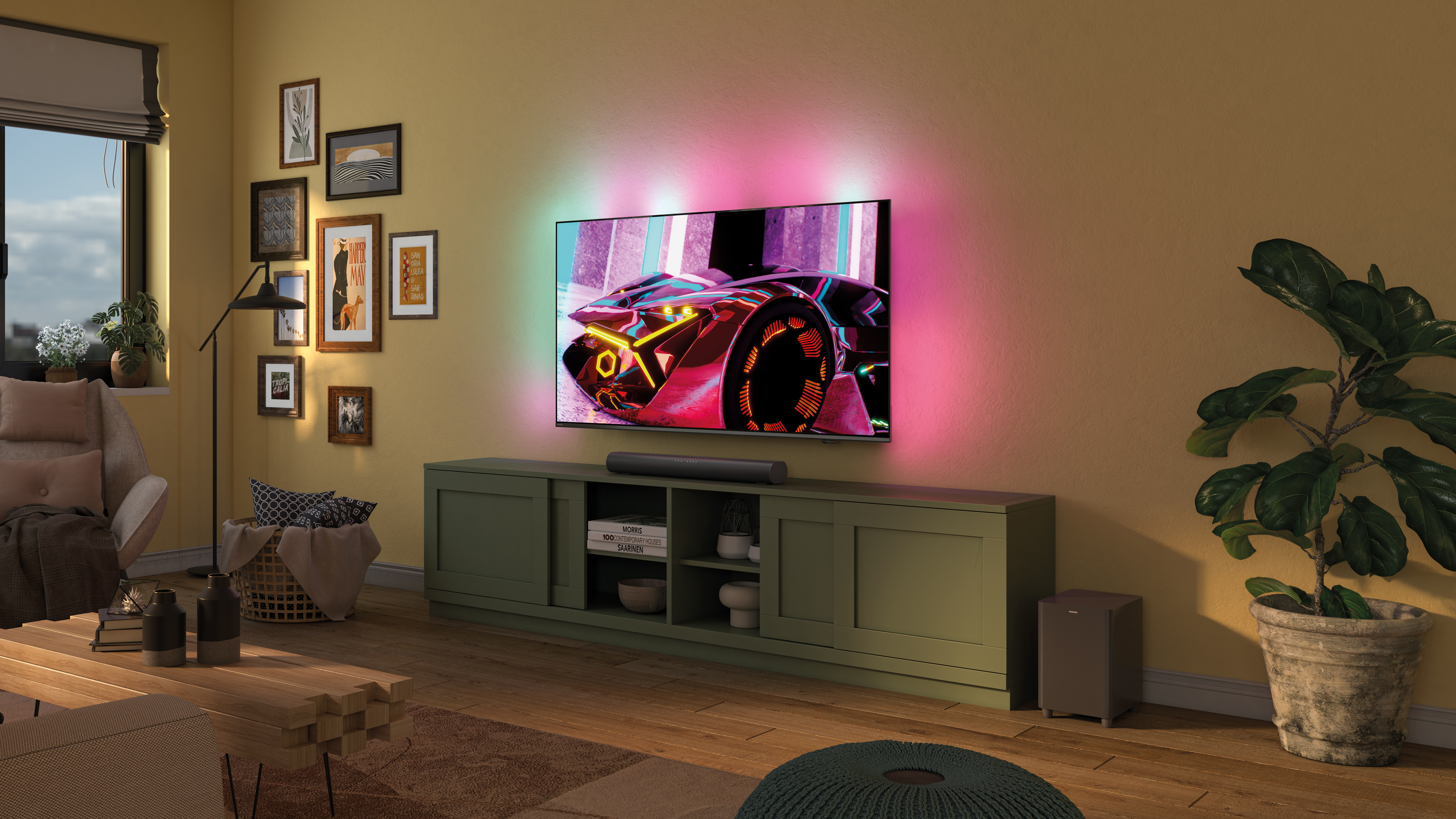 A person relaxes in front of an Ambilight TV, with a soundbar below