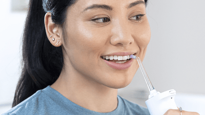 Patient using power flosser.