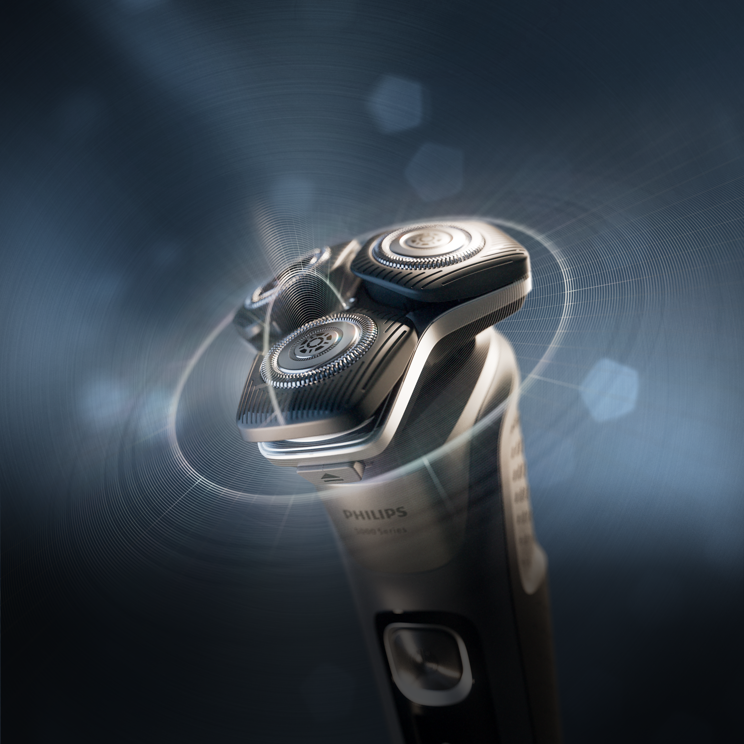 Philips rotacioni električni aparat za brijanje sa svetlećim glavama i elegantnim ergonomskim dizajnom na tamnoplavoj pozadini.