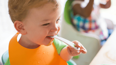 Cute bib and spoon setup in morning light