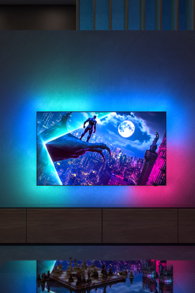 Philips OLED 950 TV showing city scene with Ambilight