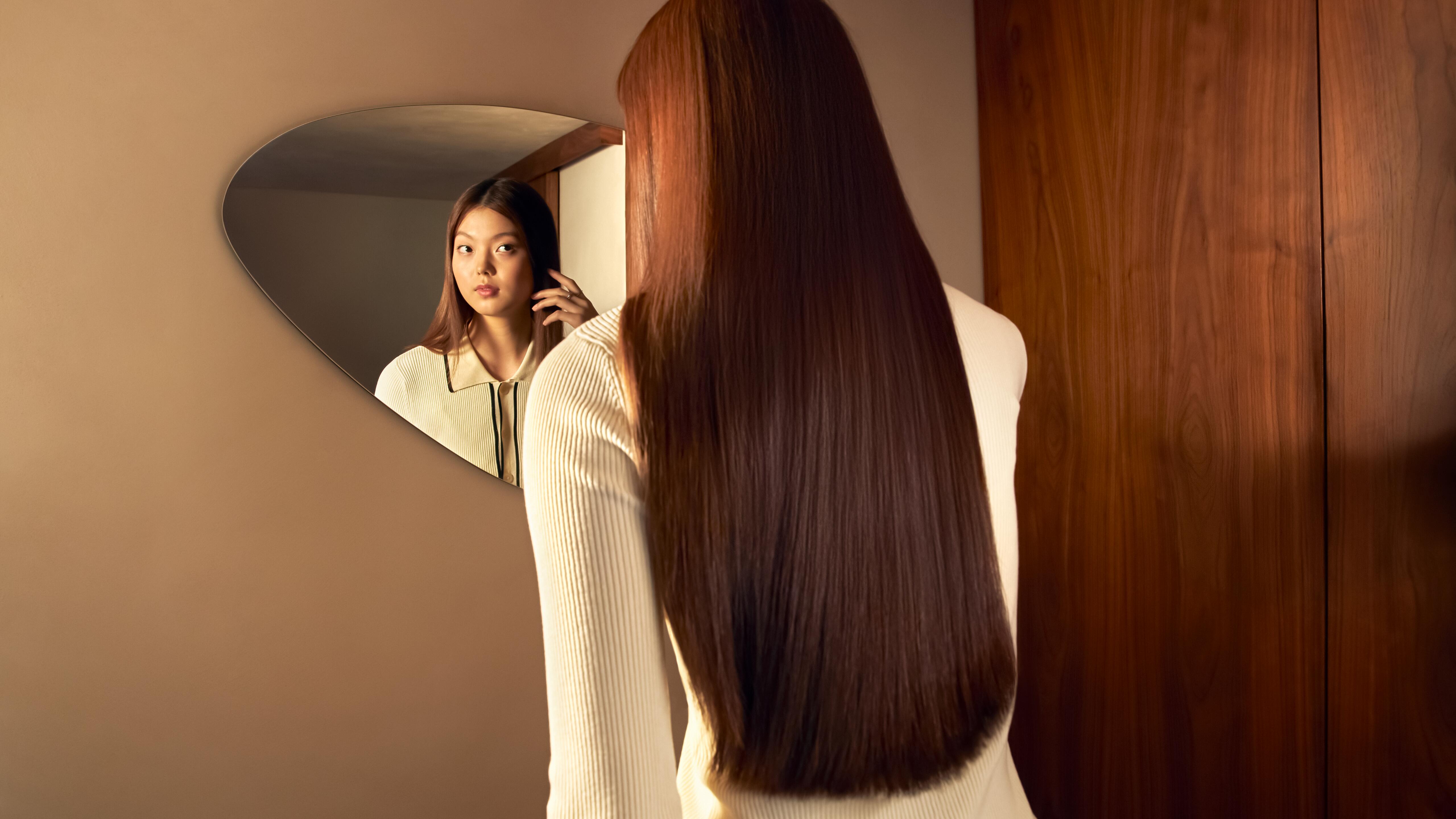 Hair dryer featuring intelligent sensors to actively monitor and adapt airflow temperature