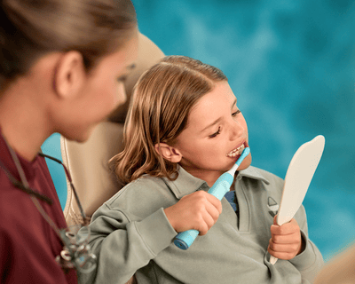 Philips Sonicare mother and daughter brushing teeth