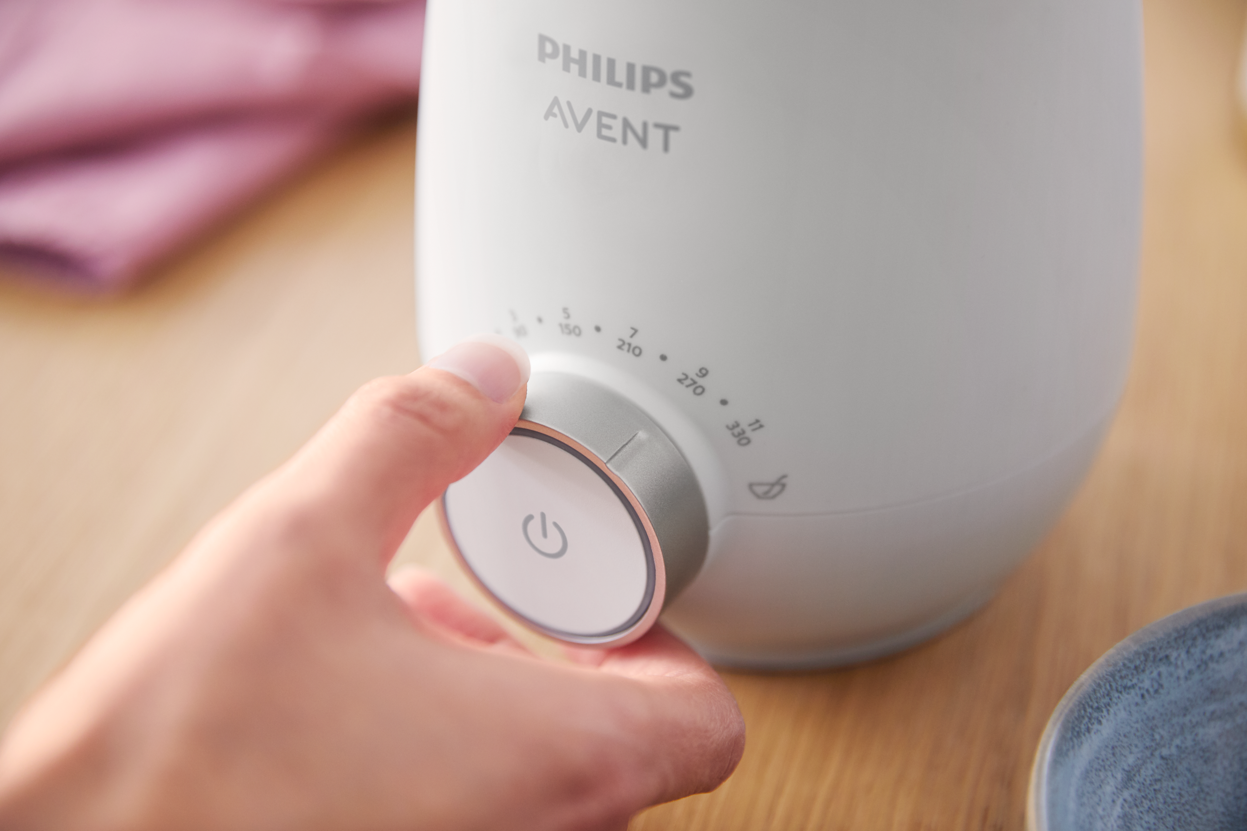 Close-up of Philips Avent bottle warmer in use
