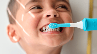 Image of child brushing teeth