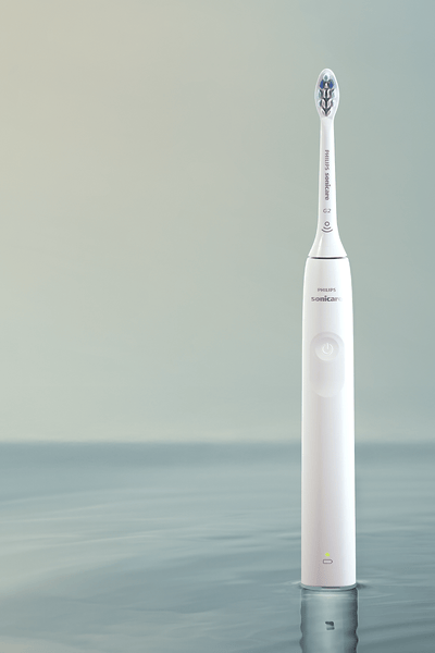 Philips Sonicare 2300 power toothbrush standing on a countertop